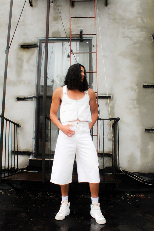 Lookbook image Lightweight long white denim shorts with removable screw buttons. Has fitted waist and 90s vintage details