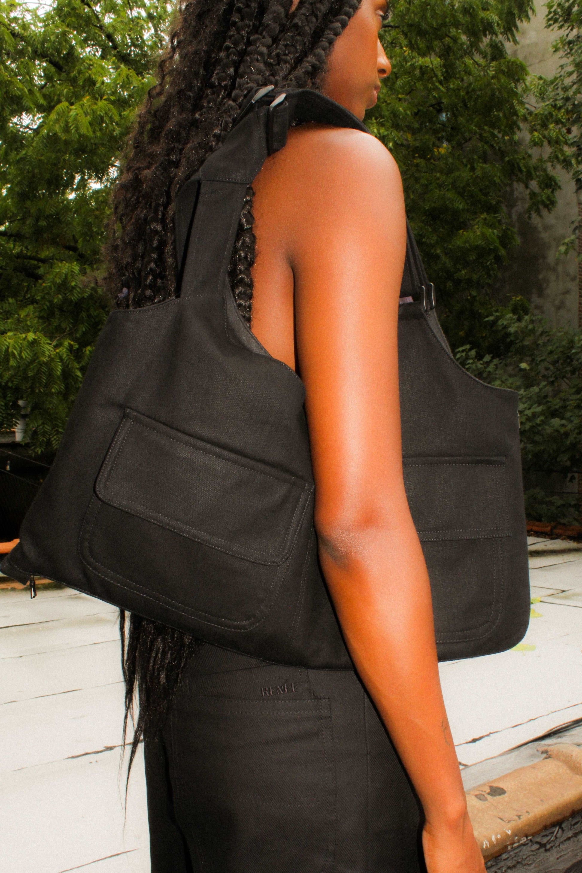 Lookbook image black denim cropped adjustable strap convertible vest bag with cargo pockets